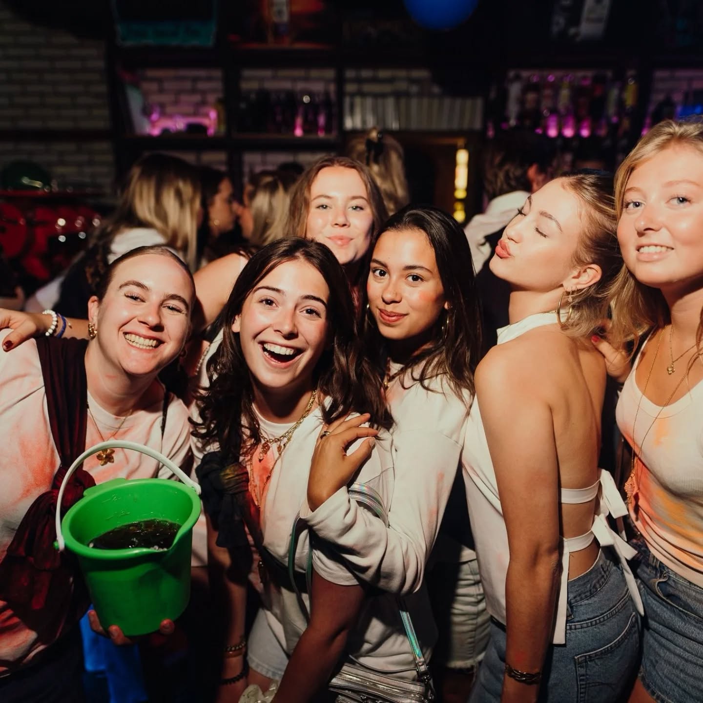 Guests partying with a drinks bucket at Bar Bascule
